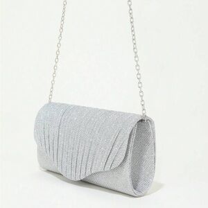 Cyber Sale $9.       Silver glitter clutch.NWOT